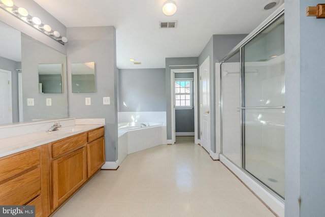 bathroom featuring independent shower and bath and vanity