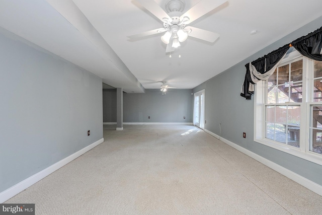 unfurnished room featuring carpet floors and ceiling fan