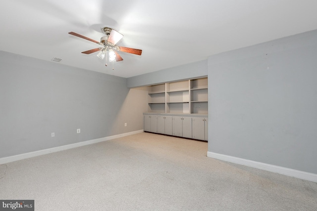 unfurnished bedroom featuring light carpet and ceiling fan