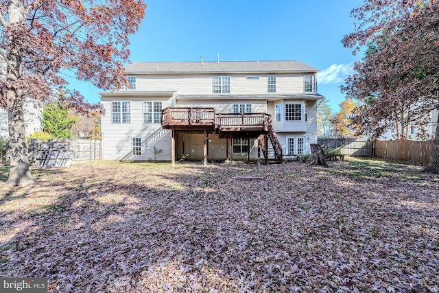 back of house featuring a wooden deck