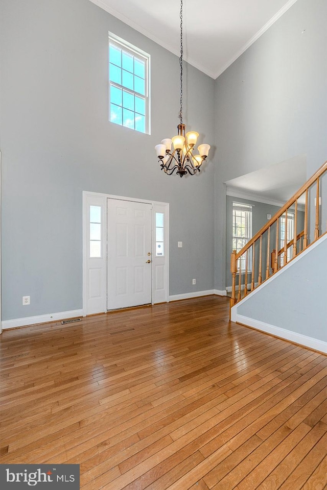 foyer entrance featuring light hardwood / wood-style floors and plenty of natural light