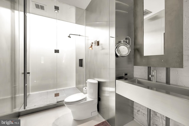 bathroom featuring an enclosed shower, vanity, and toilet