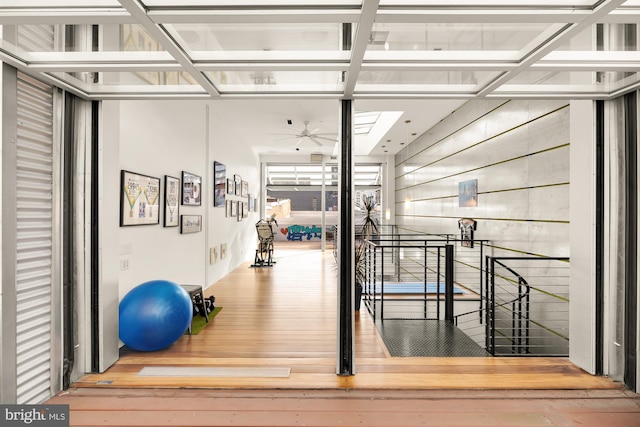 exercise room featuring hardwood / wood-style flooring and ceiling fan