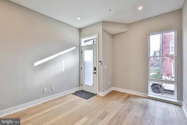 entryway with light hardwood / wood-style floors