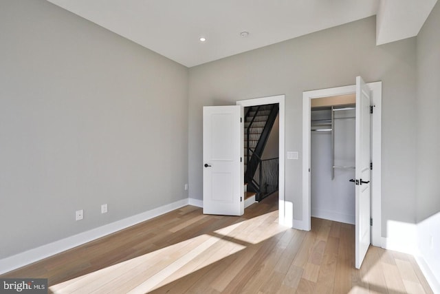 unfurnished bedroom with light wood-type flooring