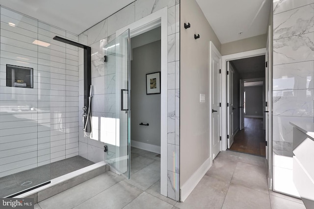 bathroom featuring tile patterned flooring and a shower with shower door