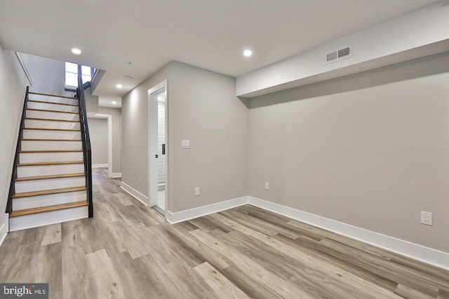 basement featuring light hardwood / wood-style flooring