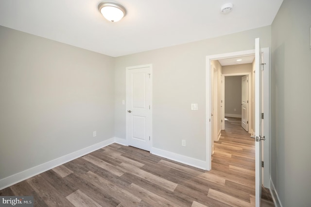 unfurnished bedroom featuring wood-type flooring