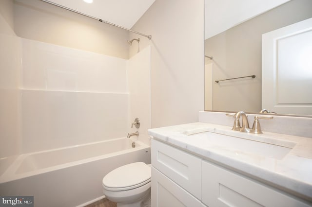 full bathroom with  shower combination, vanity, and toilet