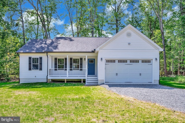 ranch-style house featuring a garage, a porch, and a front yard