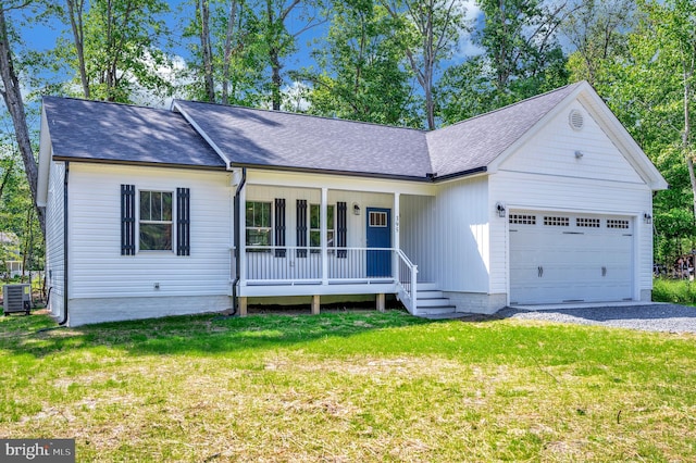 ranch-style house with a front lawn, central air condition unit, a garage, and covered porch