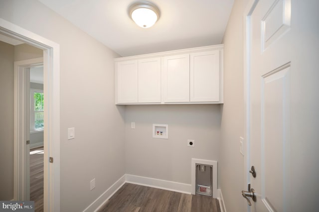 washroom featuring dark wood-type flooring, washer hookup, electric dryer hookup, and cabinets