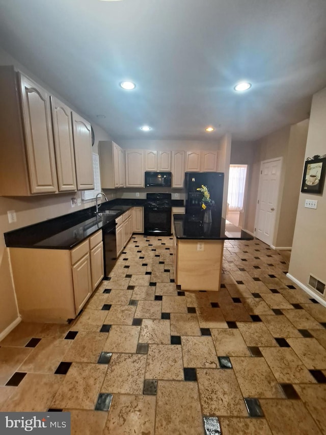 kitchen featuring sink and black appliances