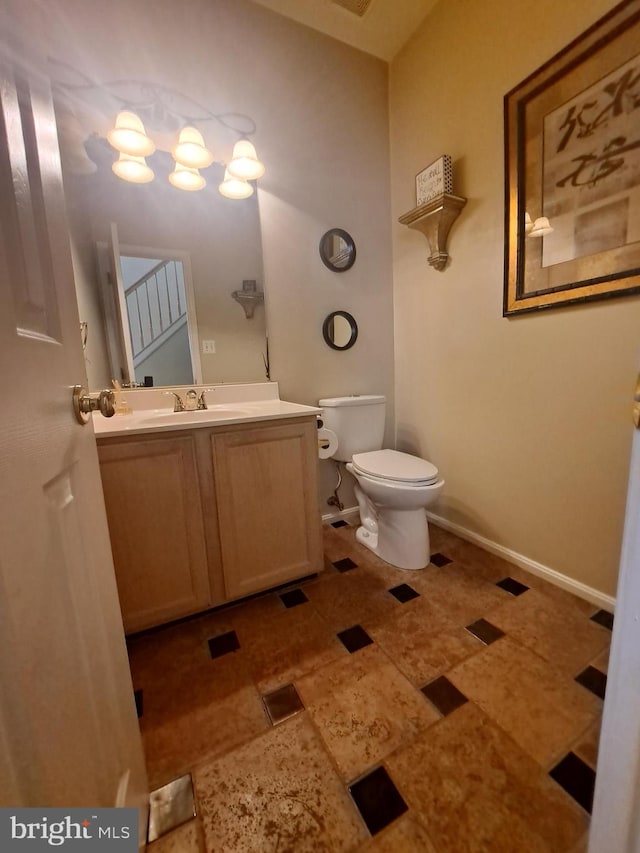 bathroom with vanity and toilet