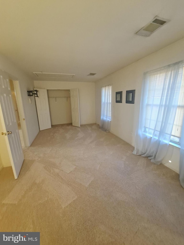 empty room featuring light colored carpet