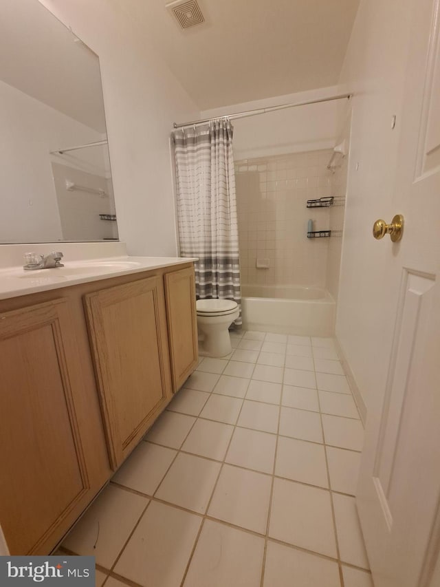 full bathroom featuring toilet, shower / bath combination with curtain, vanity, and tile patterned floors