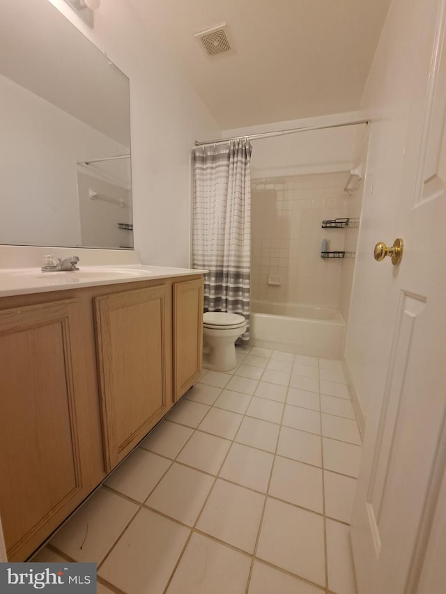 full bathroom with tile patterned floors, shower / bath combo, toilet, and vanity