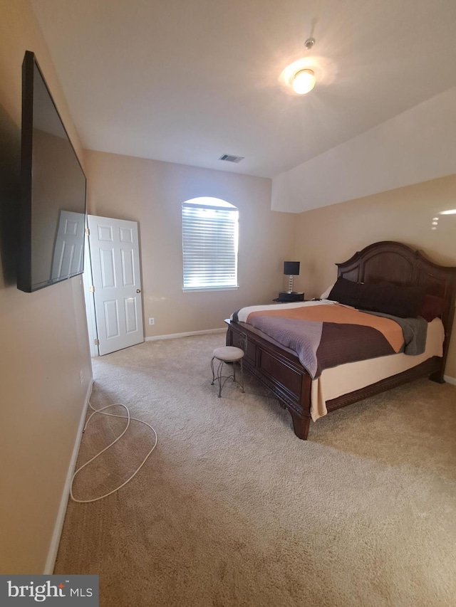 bedroom featuring light colored carpet