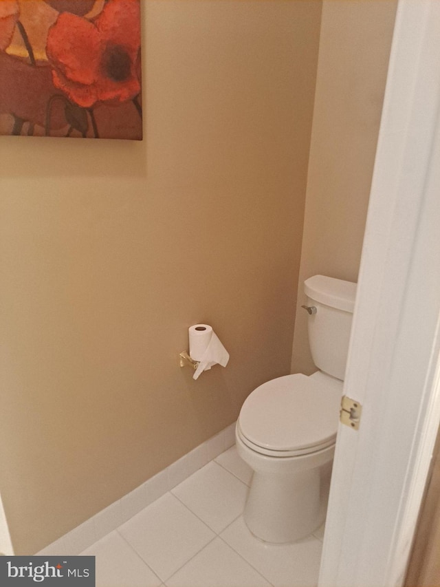 bathroom featuring tile patterned flooring and toilet