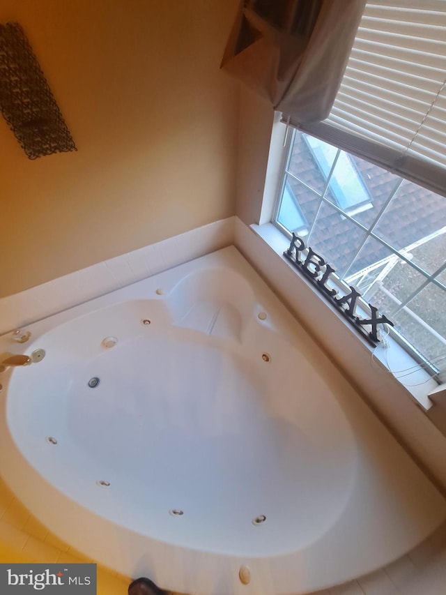 bathroom featuring a tub to relax in