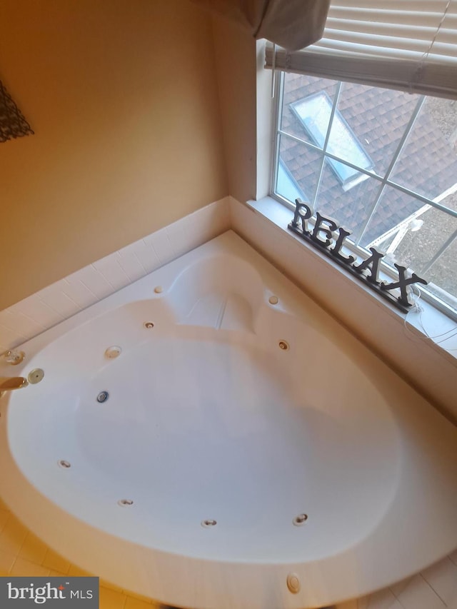 bathroom featuring a bathing tub and tile patterned flooring