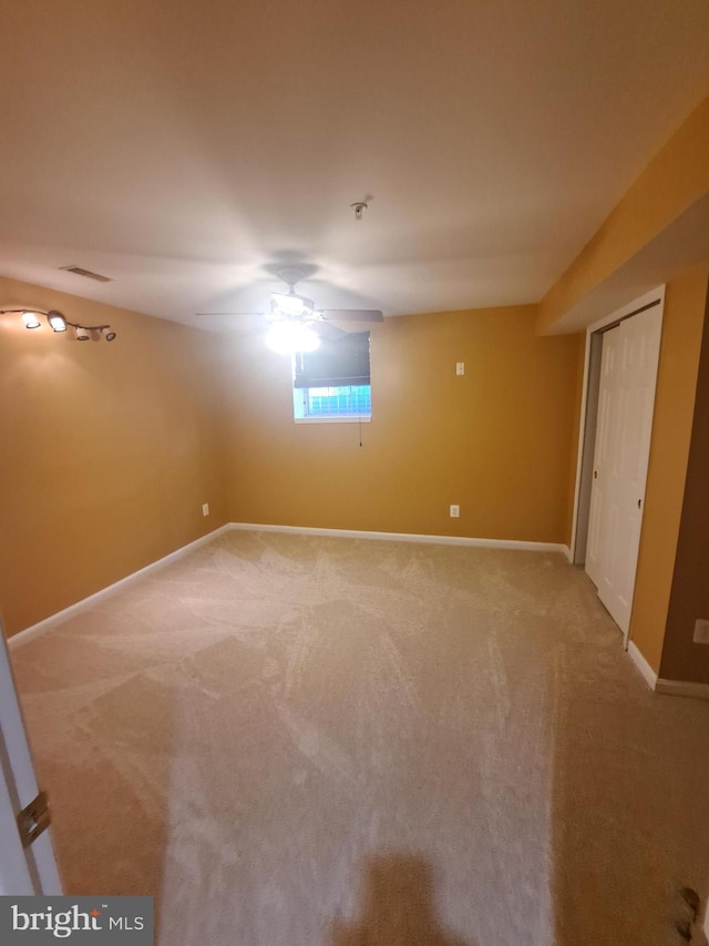 unfurnished bedroom featuring carpet flooring and ceiling fan