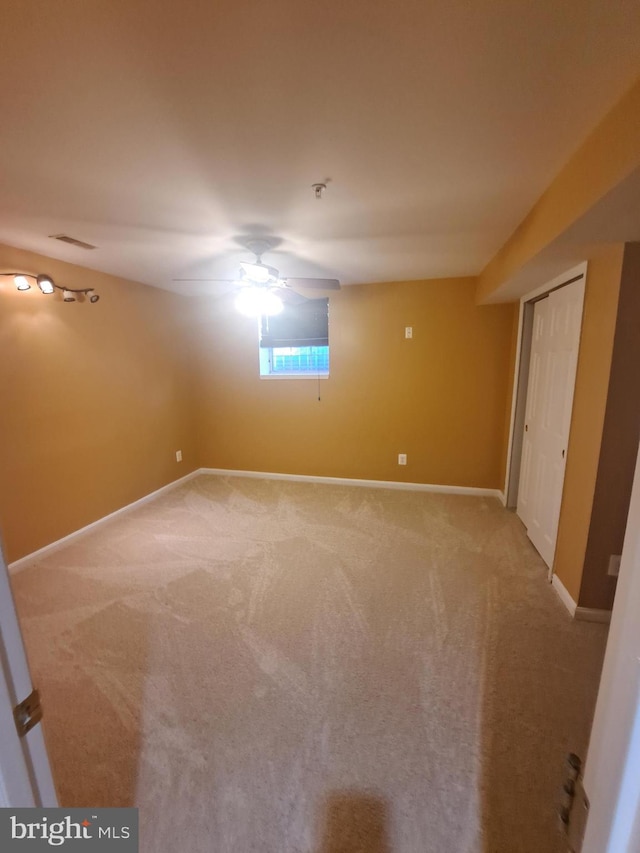 unfurnished bedroom featuring carpet floors and ceiling fan