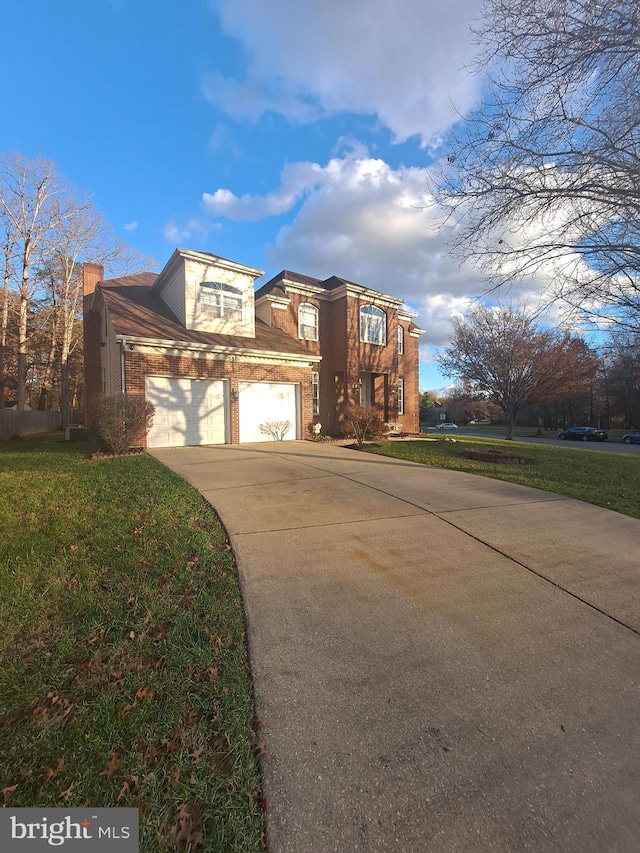 view of front of home with a garage and a front yard