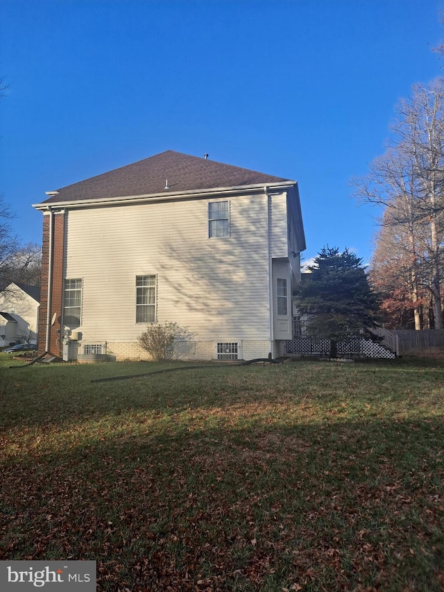 view of property exterior with a yard