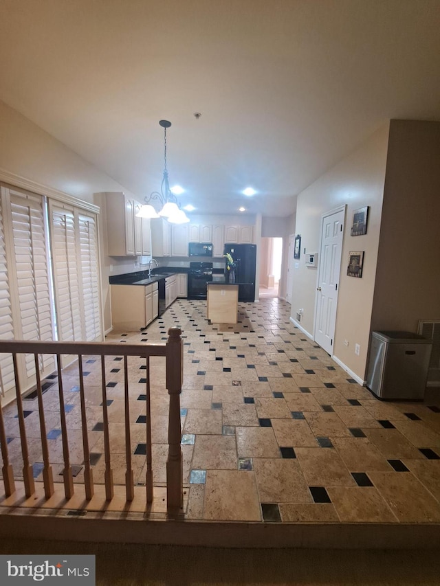 interior space with a notable chandelier and sink