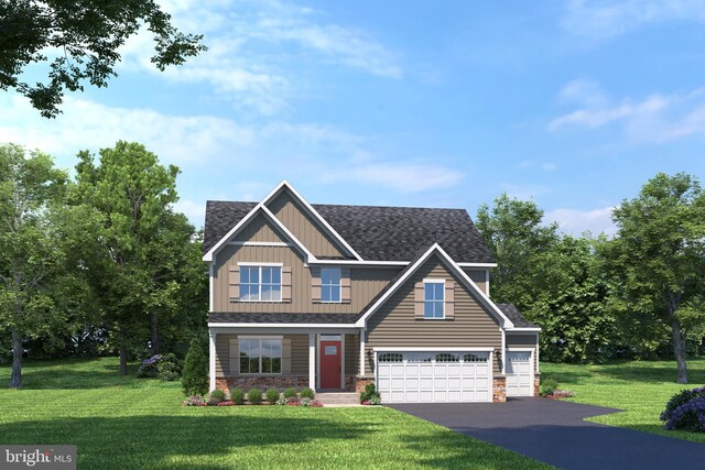 craftsman house with a garage and a front yard