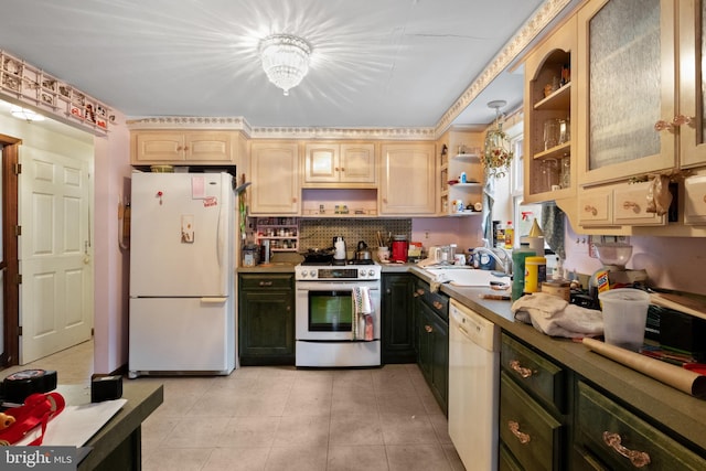 kitchen with white appliances, an inviting chandelier, sink, light tile patterned floors, and light brown cabinetry