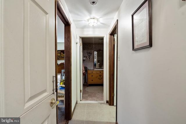 corridor featuring light tile patterned flooring