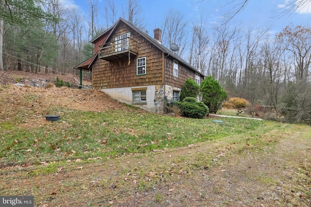 view of home's exterior with a yard