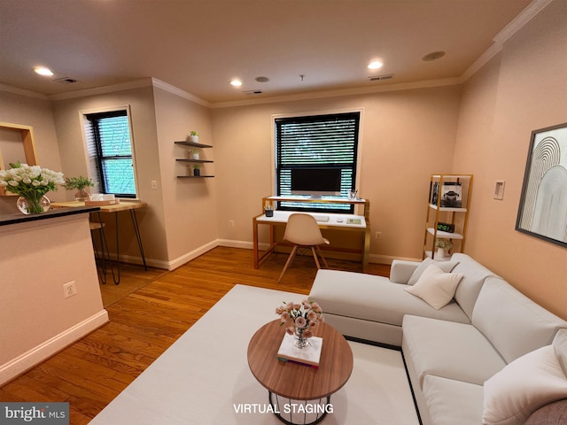 living room with ornamental molding and light wood-type flooring