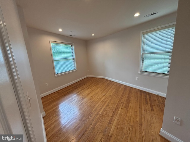 spare room with light hardwood / wood-style floors