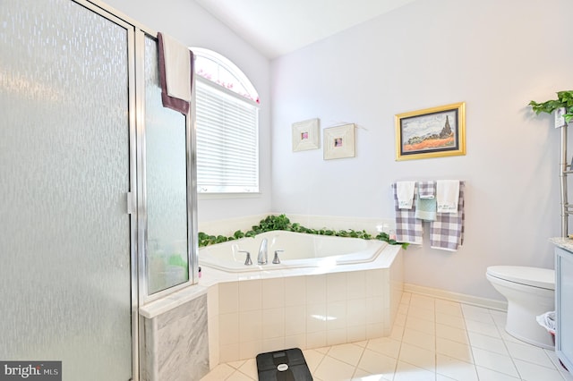 bathroom with toilet, tile patterned floors, and plus walk in shower