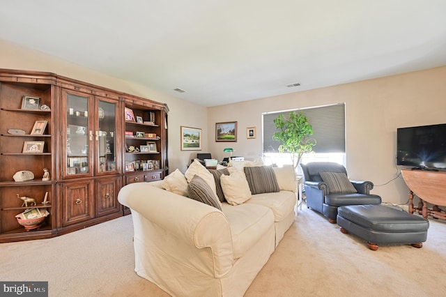 living room featuring light carpet