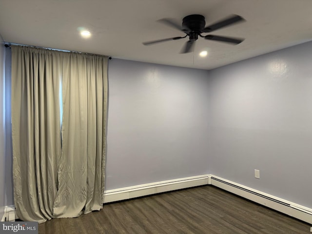 spare room featuring wood-type flooring and ceiling fan