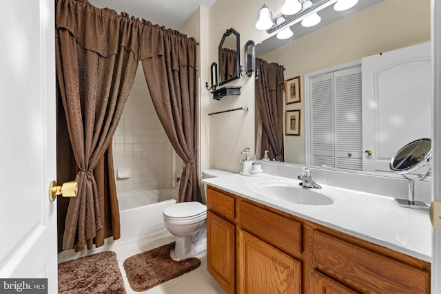 full bathroom with vanity, tile patterned floors, toilet, and shower / bath combo