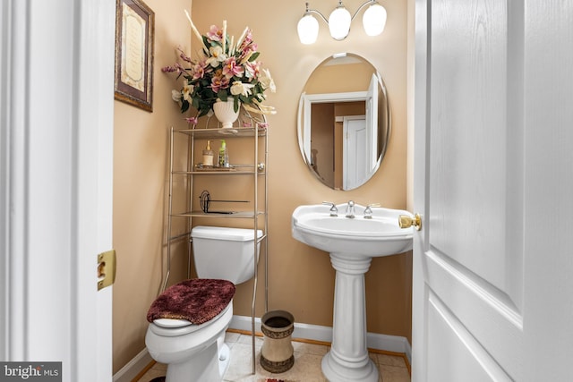 bathroom featuring tile patterned flooring and toilet