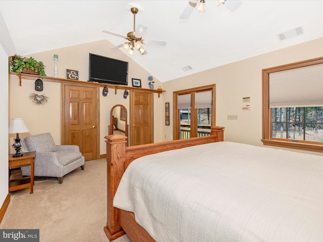 carpeted bedroom featuring ceiling fan and lofted ceiling