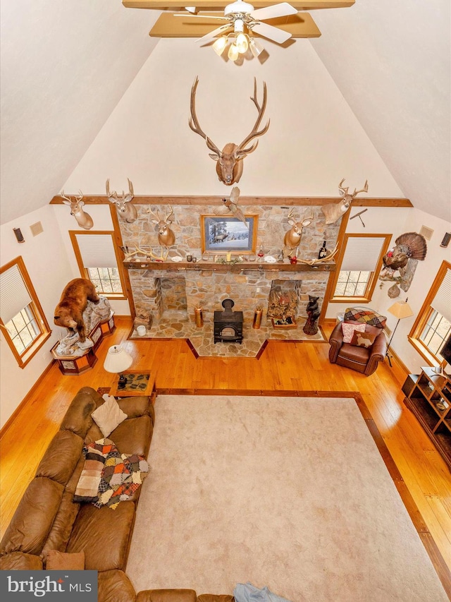 unfurnished living room with hardwood / wood-style flooring, ceiling fan, and lofted ceiling