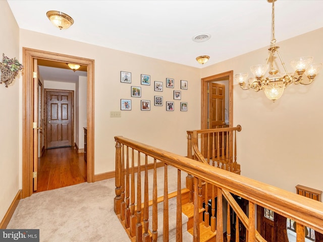 4414 Mountville Rd, Frederick, MD 21703 - hallway featuring an upstairs landing, a chandelier, baseboards, and carpet floors