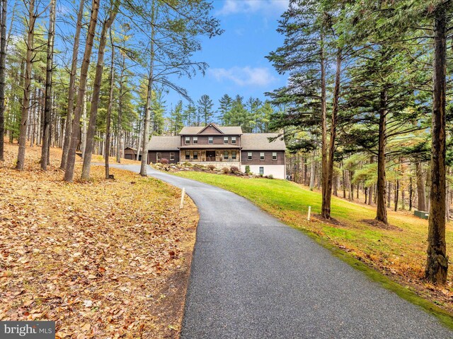 4414 Mountville Rd, Frederick, MD 21703 - view of front of house with a front yard, stone siding, and asphalt driveway