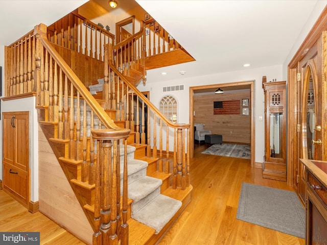 staircase featuring hardwood / wood-style floors