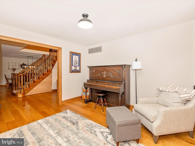 4414 Mountville Rd, Frederick, MD 21703 - sitting room featuring stairs, wood finished floors, and baseboards
