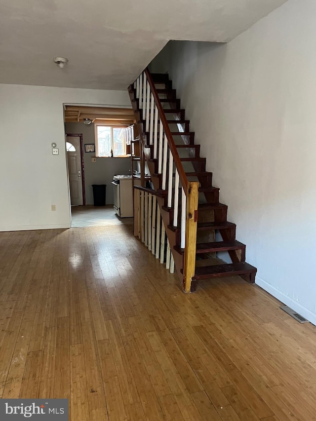 staircase featuring hardwood / wood-style flooring