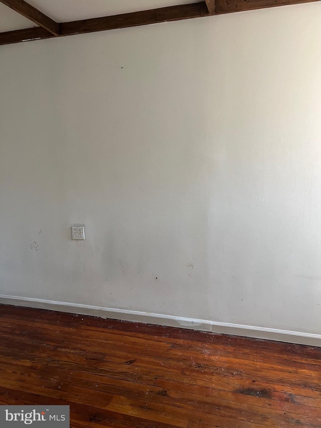 spare room featuring dark hardwood / wood-style flooring