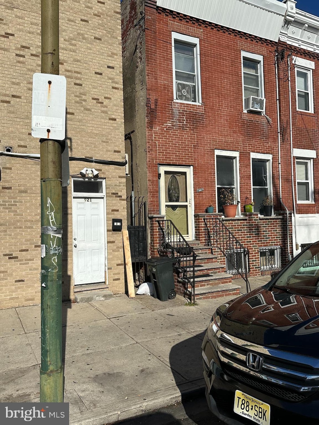 doorway to property featuring cooling unit